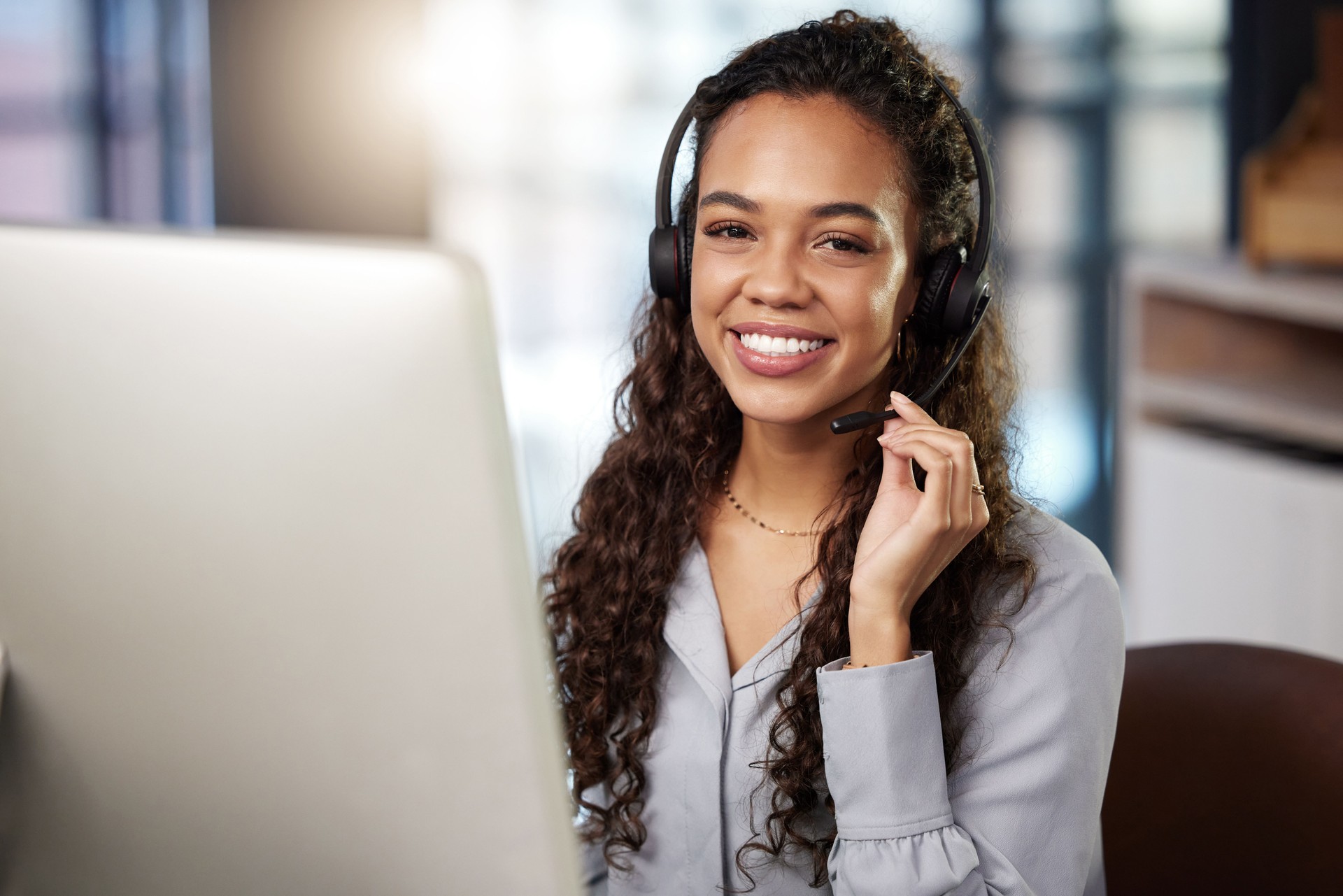 Shot of a young businesswoman working in a  call center